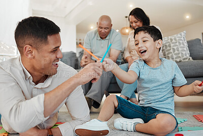 Buy stock photo Family, grandparents and father playing with child in a lounge floor in a home bonding for quality time together. Happy, love and dad with kid in a living room as a family with care and happiness