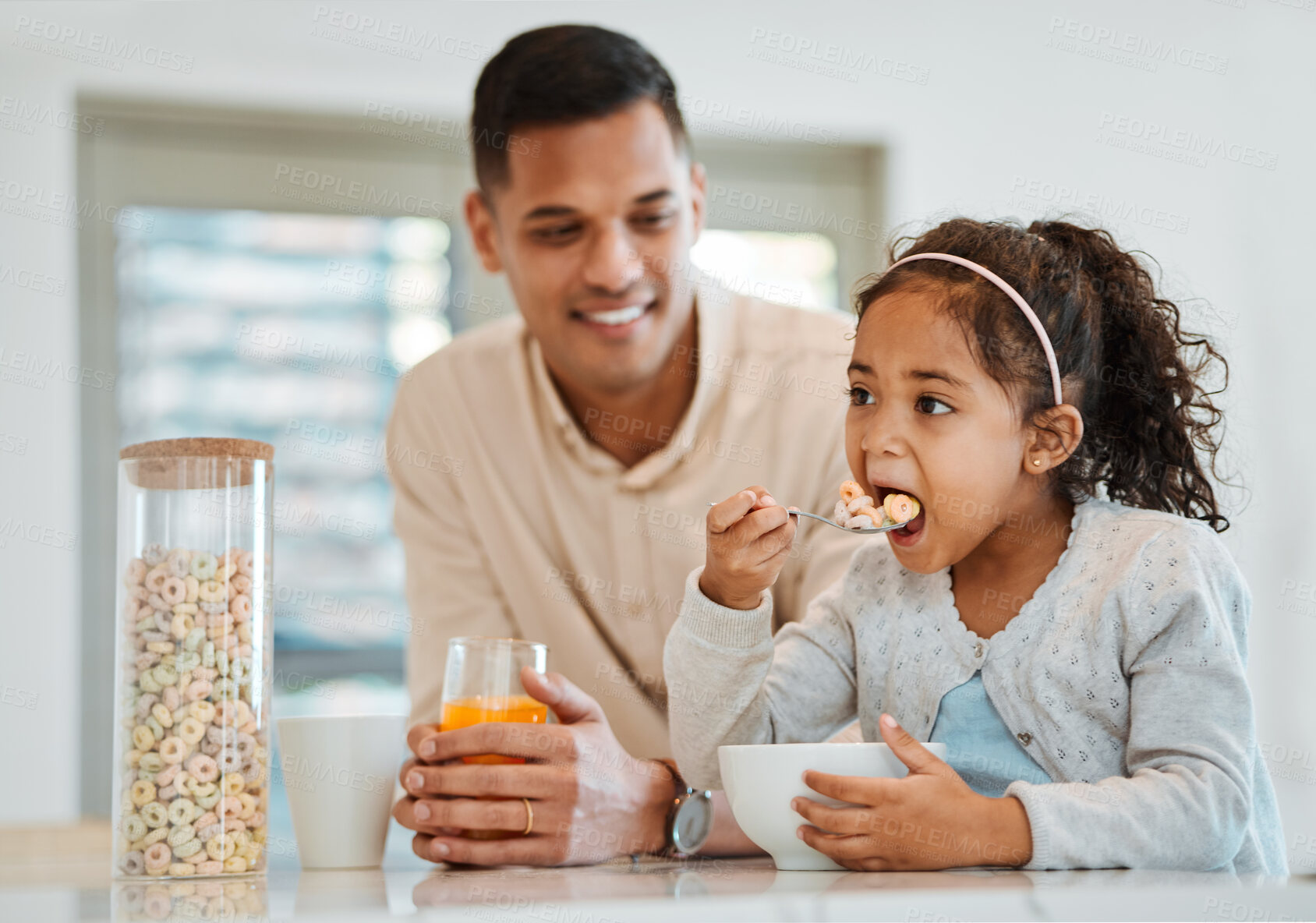 Buy stock photo Eating, morning and a child with father for breakfast, food in the kitchen and care for nutrition. Smile, together and a young dad with a girl kid with cereal in a house for health and hungry