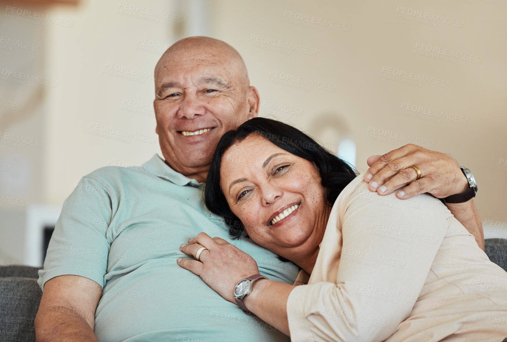 Buy stock photo Portrait, smile and senior couple in home living room, bonding and relax together. Face, happy and elderly man and woman hug on sofa in lounge, enjoying quality time in house with love and retirement