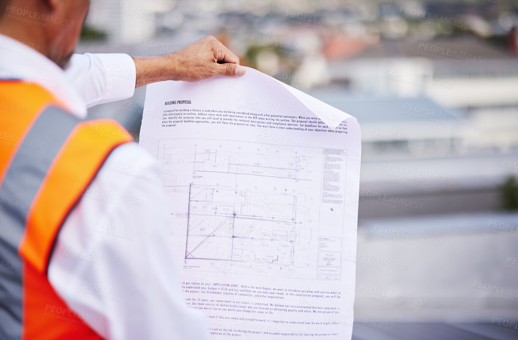 Buy stock photo Construction site, blueprint and man reading document of building proposal in city from the back. Closeup design of floor plan, project or architecture for industrial development in civil engineering