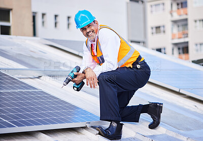 Buy stock photo Solar panels, man and portrait with drill for engineering, grid and building maintenance in city. Electrician, construction tools and smile for energy saving project, photovoltaic system and rooftop