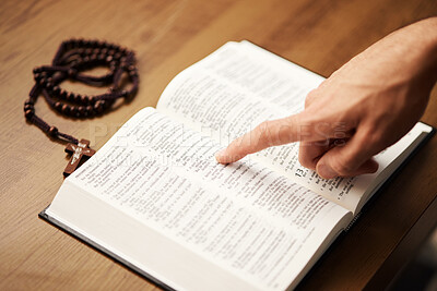 Hands, person and reading bible with rosary cross for praying, spiritual faith and holy worship of God. Closeup of christian studying religion, gospel prayer books and learning praise to jesus christ