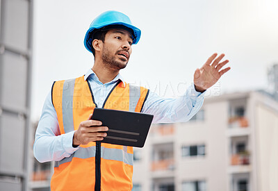 Buy stock photo Asian man, architect and tablet in city for management on construction site, inspection or coordination. Male person, engineer or contractor working on technology for architecture or maintenance