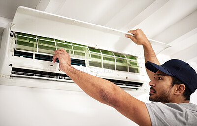 Buy stock photo Maintenance, air conditioner technician and man with filter, working on ventilation or ac repair. Contractor, handyman or electric aircon machine expert problem solving or cleaning dust in office
