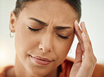 Face, woman and pain of headache from stress, mental health problem and sick of fatigue. Closeup of sad female person with depression, anxiety or frustrated with brain fog, debt and crisis of burnout