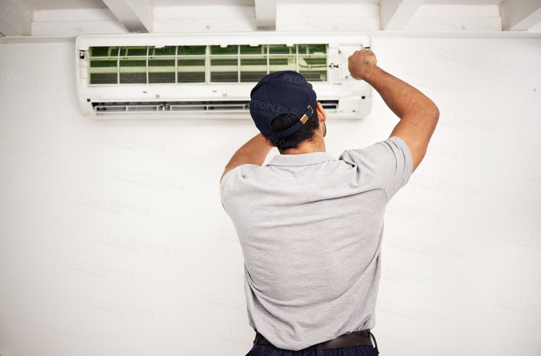 Buy stock photo Maintenance, air conditioning technician and man from back working on ventilation filter for ac repair. Contractor, handyman or electric aircon machine expert problem solving, electrician with tools.