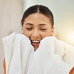 Smile, woman and smell clean towel, fresh scent and fabric after washing cotton or textile for housekeeping in home. Laundry, aroma and happy person with cloth after cleaning for hygiene and wellness