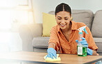 Spray, woman and smile for cleaning table, furniture and housekeeping services at home. Female cleaner wipe surface with cloth, bottle of chemical product and disinfection of dust, bacteria and dirt