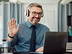 Headphones, laptop and man wave on video call for business, smile and online chat at home. Happy, hello and webinar of mature manager with glasses in virtual meeting, communication and remote work