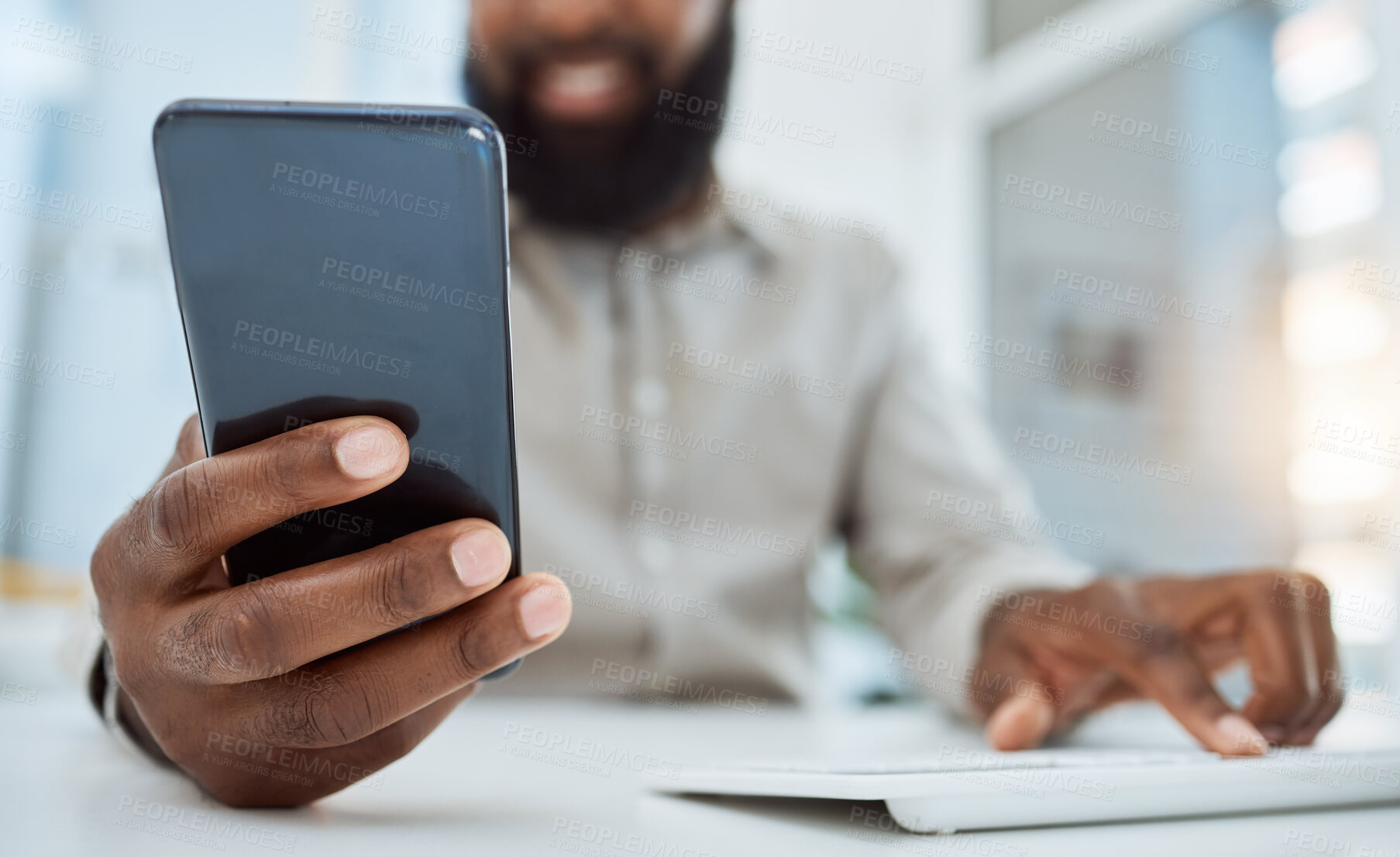 Buy stock photo Business man, hands and typing on smartphone at computer in office for social network, mobile website and digital contact. Closeup of worker reading news, notification and app on cellphone at pc desk