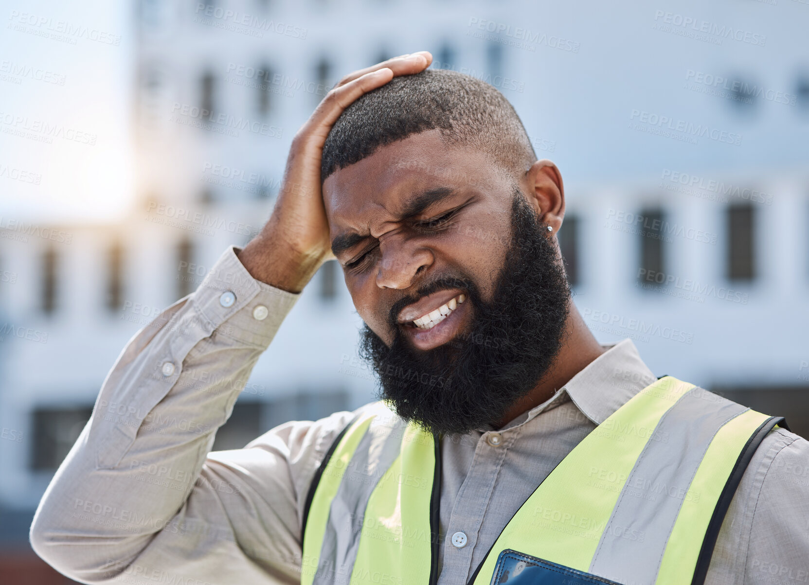 Buy stock photo Black man, architect and headache in city from stress, burnout or mistake on rooftop with pain in construction. African male person, engineer or contractor with mental health or migraine on site