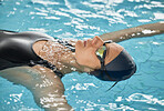 Sports, floating or calm woman in swimming pool training for an activity, wellness or fitness workout. Breathing, peace or healthy female athlete swimmer in the water for exercise or resting to relax