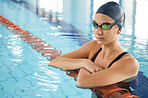 Swimming, thinking and a woman in a pool for training, competition or fitness. Idea, serious and a professional athlete swimmer or girl in the water for exercise, cardio or sports for health