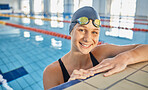 Water, woman and portrait in swimming pool for competition, training or professional sports or exercise in gym. Swimmer, smile or happiness for winning, achievement or wellness in cardio workout