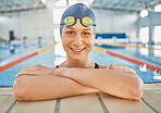 Woman, water, and portrait in swimming pool for competition, training or professional sports or exercise in gym or club. Swimmer, smile or happy for winning, achievement or wellness in cardio workout