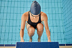 Swimming pool, sports and woman for back stroke for exercise, training and workout for competition in gym. Fitness, water sport and female swimmer on start block for race, challenge and performance