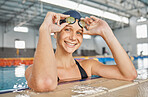 Swimming pool, portrait and woman smile with goggles in water for exercise, workout or sport. Face, swim athlete and person happy for fitness, training or wellness, health and confidence in Australia