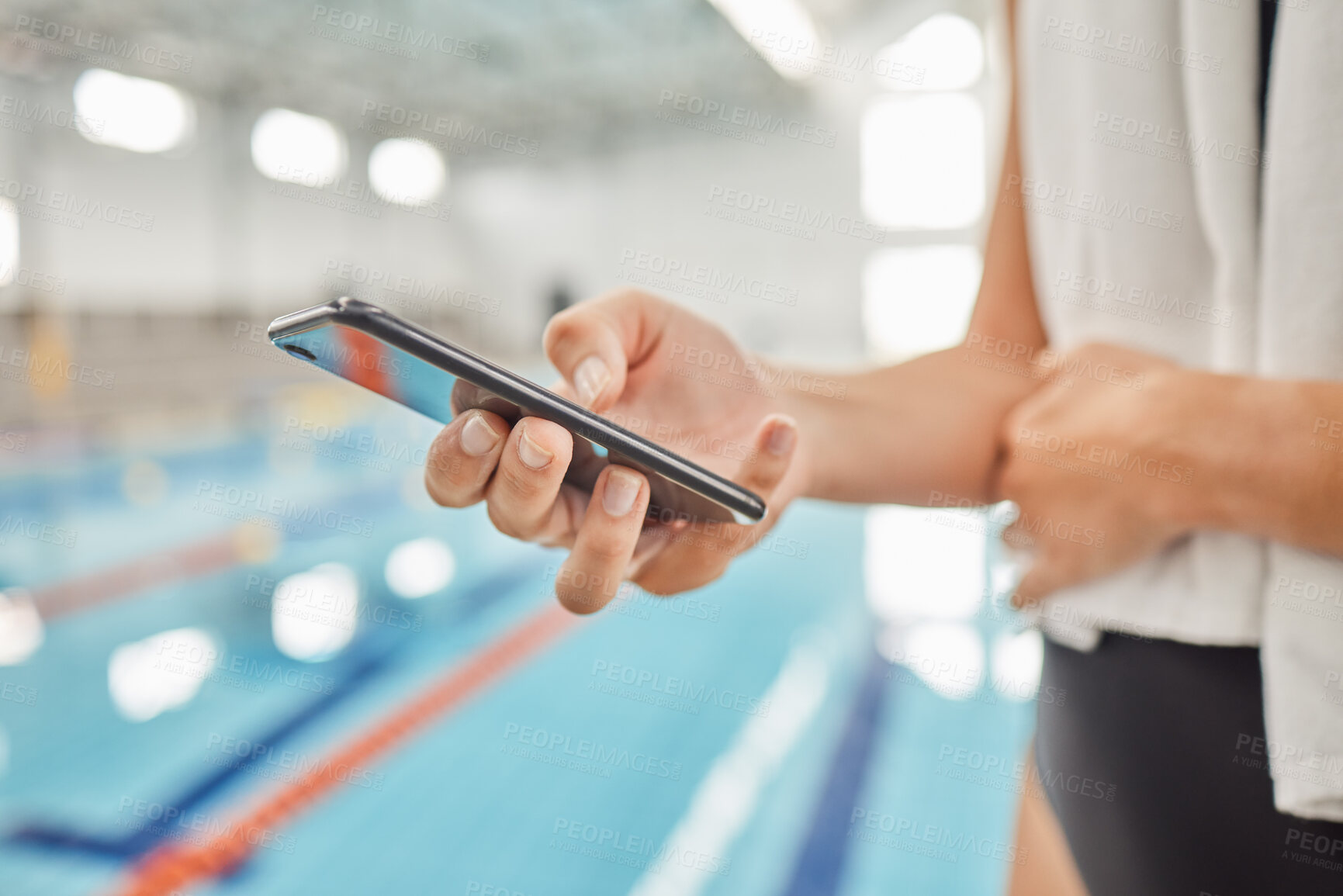 Buy stock photo Phone, hands and athlete at swimming pool with social media, scrolling online or browsing internet after exercise. Swim, sports and person with cellphone for communication after workout or training