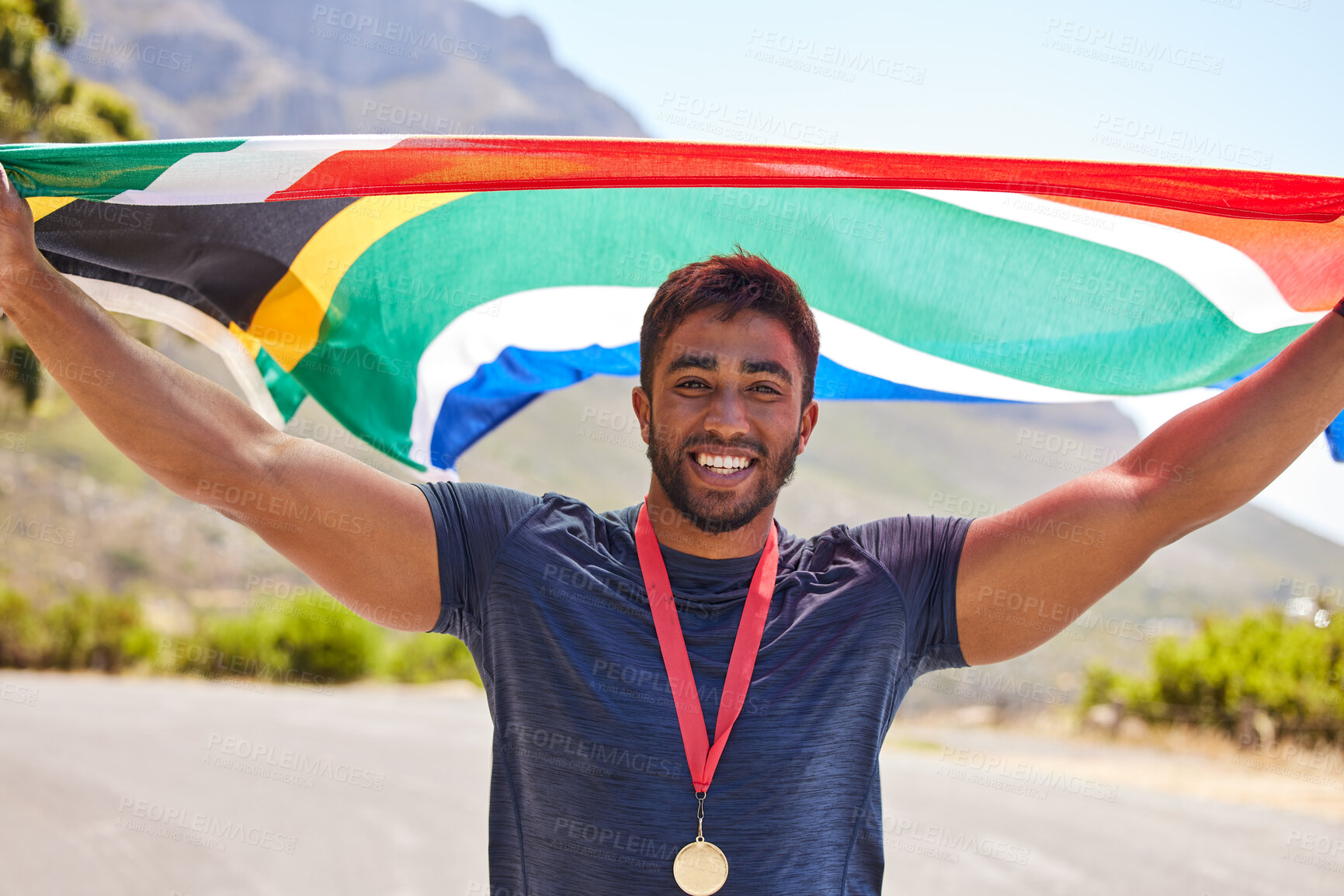 Buy stock photo Runner, success and portrait of happy man with flag on road for fitness goal, winning or running race. Sports champion, winner or proud South African or excited athlete with victory or gold medal