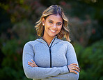 Runner woman, arms crossed and portrait in park, smile and exercise with fitness training in nature. Indian girl, happy and pride for wellness, health or outdoor workout for body, self care or goals