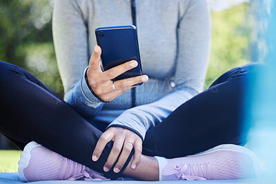 Buy stock photo Yoga, phone and hands of woman in park for fitness app, social media and workout. Relax, technology and communication with closeup of female person and mobile in nature for search, exercise and peace