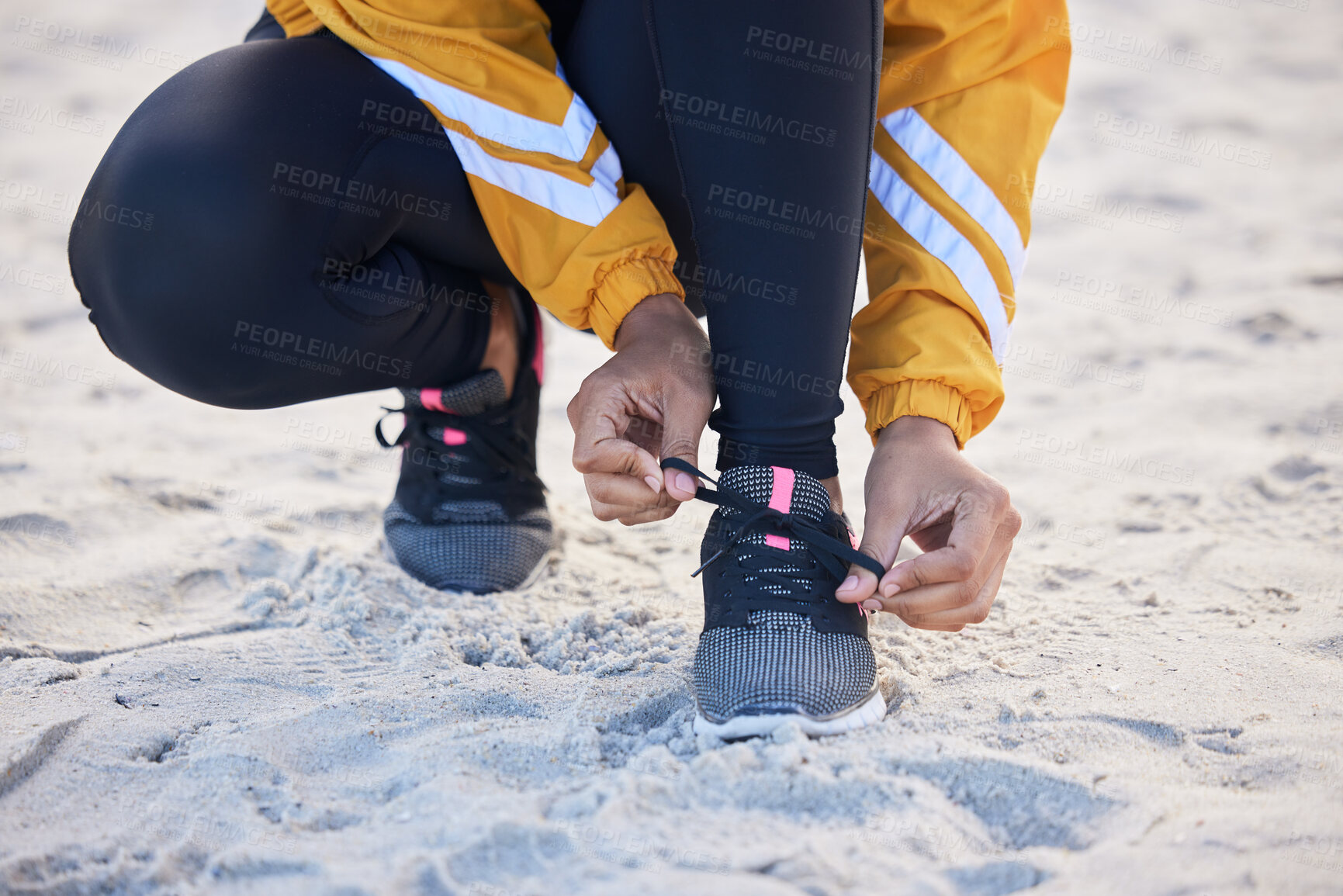 Buy stock photo Beach, closeup and woman tie shoes for an outdoor run for fitness, health and wellness by seaside. Sports, athlete and zoom of female runner tying laces for a cardio workout or exercise by the ocean.