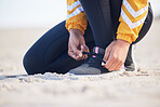 Beach, closeup and woman tie laces for an outdoor run for fitness, health and wellness by seaside. Sports, athlete and zoom of female runner preparing for a cardio workout or exercise by the ocean.