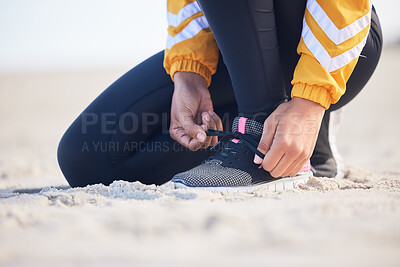 Buy stock photo Beach, closeup and woman tie laces for an outdoor run for fitness, health and wellness by seaside. Sports, athlete and zoom of female runner preparing for a cardio workout or exercise by the ocean.
