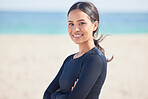 Arms crossed, beach and portrait of happy woman by the ocean ready for surf, exercise and workout. Female person, focus and face of a athlete from Hawaii outdoor by the sea in nature with training