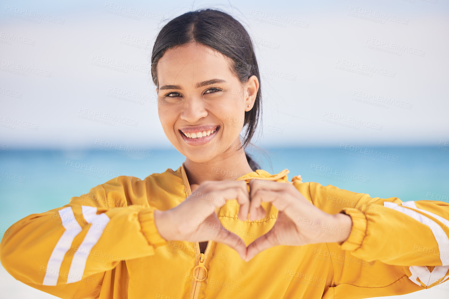 Buy stock photo Happy woman, portrait and heart hands on beach for love, care or support in trust, health or romance. Outdoor female person with emoji, symbol or icon for like or wellness in peace, sign or emoticon