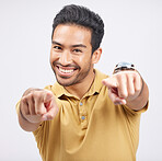 Portrait, smile of Asian man and pointing to you in studio isolated on a white background. Face, happy and person with choice, decision or selection of option, winner and hiring, recruitment and vote