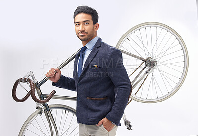 Buy stock photo Business man, bicycle and studio portrait with retro suit, sustainable transport or pride by white background. Young entrepreneur, vintage fashion and bike for travel, transportation and eco friendly