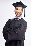 Student man, arms crossed and graduation in studio portrait, smile and success by white background. Young guy, happy university graduate and education achievement with pride, goals and celebration