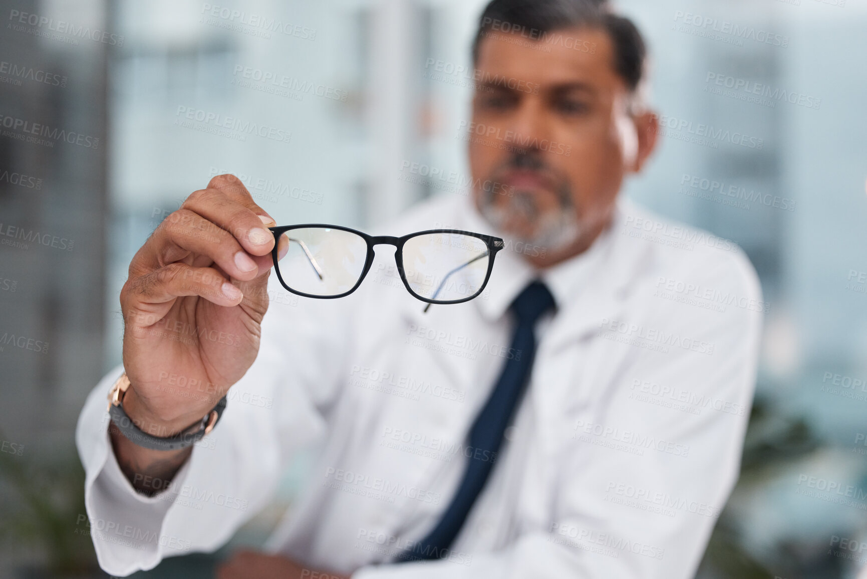 Buy stock photo Hands, man and optician with glasses for vision, eyesight and medical eye care of prescription lens. Closeup of optometrist show frame for eyewear, test or consulting for optical assessment in clinic