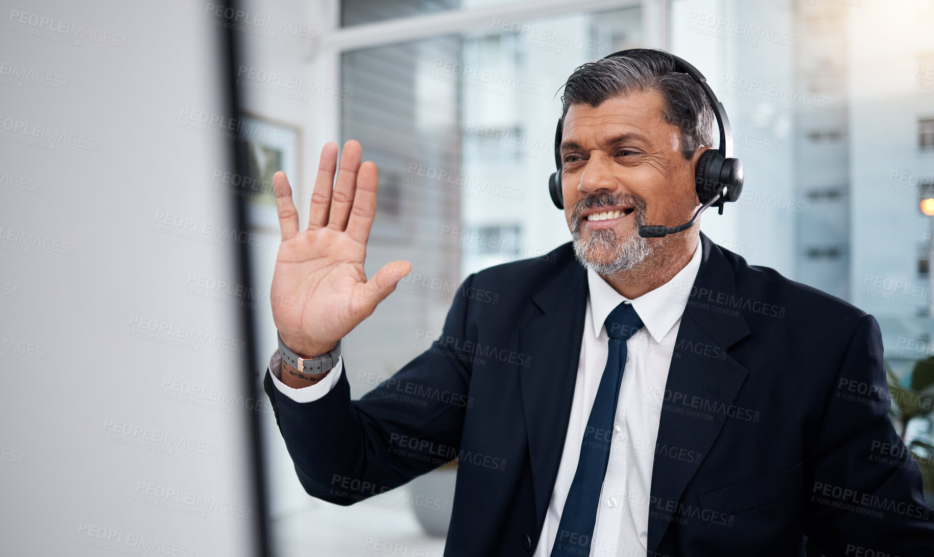 Buy stock photo Video call, telemarketing and man wave on computer for communication in office. Hello, smile and mature customer service consultant or sales manager in crm webinar, virtual meeting and online chat