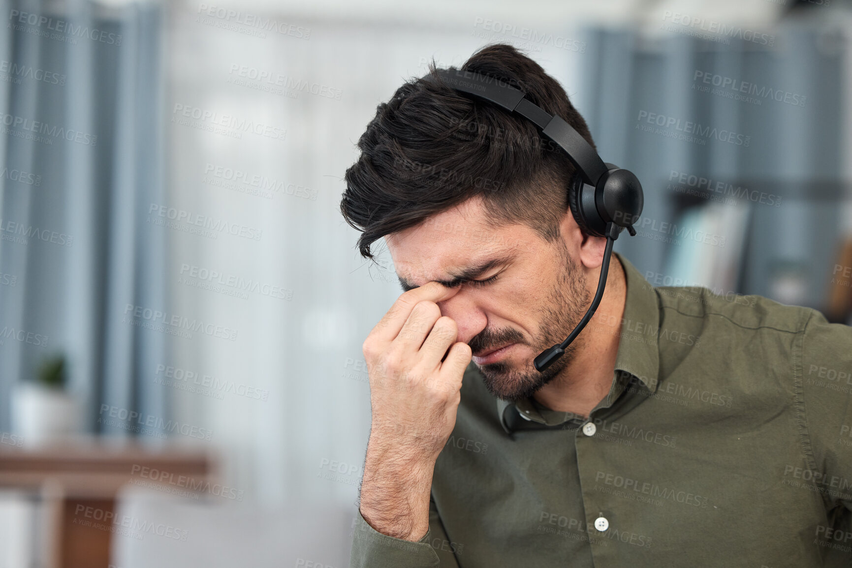 Buy stock photo Telemarketing, tech support and man with a headache, burnout and overtime with stress, pain and tension. Male person, employee and consultant with a migraine, health problem and agent with fatigue