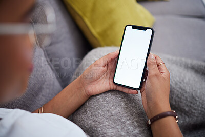 Buy stock photo Screen, mockup and hands of woman with phone on a couch for ux, internet and web search on social media. Website, smartphone and person relax on a sofa with mobile connection or online shopping