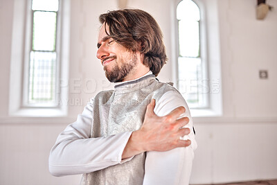 Buy stock photo Man, fencing and injury, shoulder pain or accident after training, exercise and workout in club. Fencer, arm problem and athlete with arthritis, fibromyalgia and osteoporosis, wound and emergency