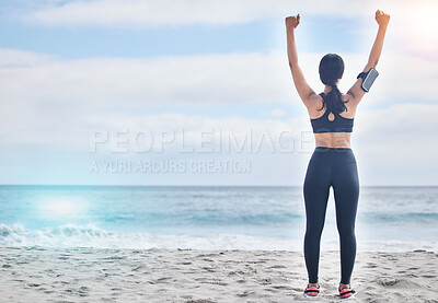 Buy stock photo Fitness, celebration and woman with arms up at beach, mockup and winning achievement in nature. Ocean, goals and exercise girl for workout motivation, victory and blue sky with waves in natural space