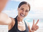 Fitness, selfie and woman at beach with peace hands for running, sports or exercise in nature. Portrait, happy and lady health and wellness influencer smile for social media, blog or profile picture
