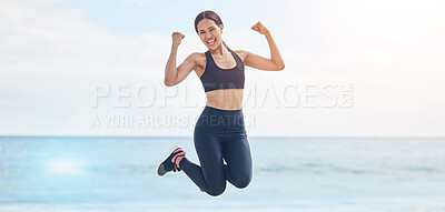 Buy stock photo Portrait, freedom and fitness woman jump at the beach with celebration after running, training or workout success in nature. Exercise, jumping and female runner at the sea celebrating goal milestone