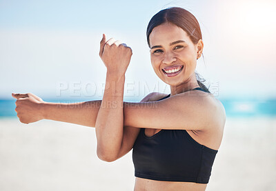 Buy stock photo Beach, portrait and happy woman stretching arm in nature for fitness, running or exercise, body or wellness. Face, smile and lady runner with shoulder stretch at sea for sports, training or ocean run