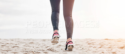 Buy stock photo Fitness, legs and feet running on beach sand for exercise, sports athlete or energy with mockup space from the back. Banner, closeup or shoes of runner at ocean for cardio workout, training or action