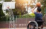 Sports, basketball and man in wheelchair shoot for playing competition, challenge and practice outdoors. Fitness, goals and male person with disability with ball for training, workout and exercise