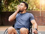 Lung, breathing and asian man in a wheelchair with asthma, pump at outdoor court for health and fitness routine. Breathe, inhaler and male with disability at a park with allergies while training