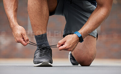 Buy stock photo Person hands, sports and tie shoes for running workout, training and action performance on ground outdoor. Closeup of athlete, runner or lace sneakers for exercise, marathon or prepare cardio fitness