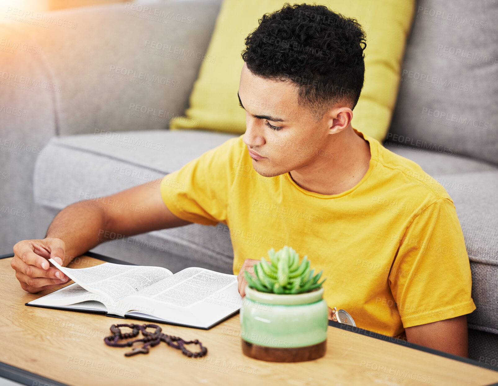 Buy stock photo Prayer, reading and bible with man in living room for worship, spiritual and Christian faith. Hope, God and belief with person praying with holy book at home for religion, thinking and gratitude