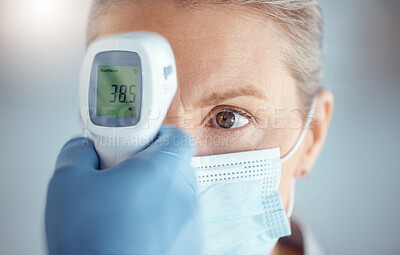 Buy stock photo Woman in mask, hand of doctor and digital thermometer in hospital for covid, safety and healthcare consultation. Temperature test, corona and patient at clinic with medical professional for exam.