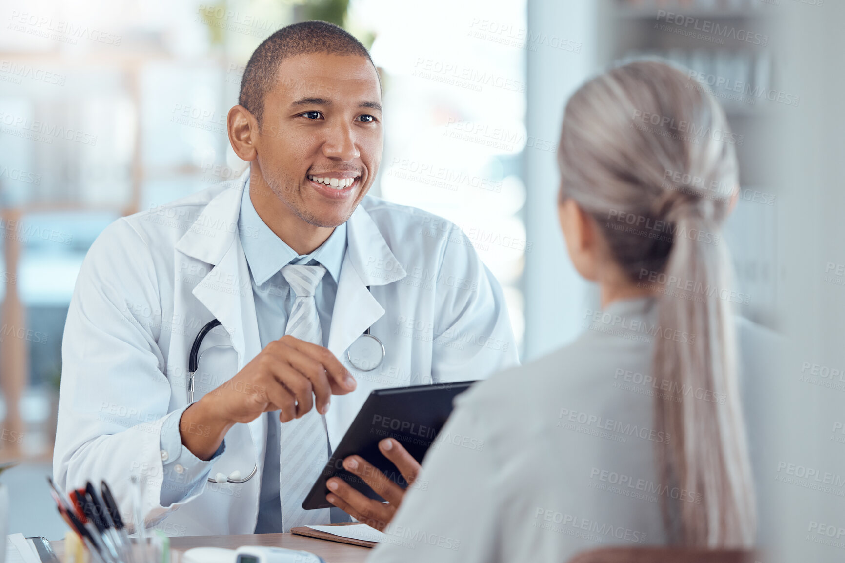 Buy stock photo Tablet, office and doctor consulting a patient in a health conversation or communication during medical consultation. Medicine, healthcare and professional talking to person for results in a clinic