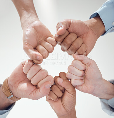 Buy stock photo Fist bump, teamwork or doctors with solidarity in collaboration for healthcare goals together. Clinic closeup, hands or low angle of medical nurses with group support, motivation or mission in circle